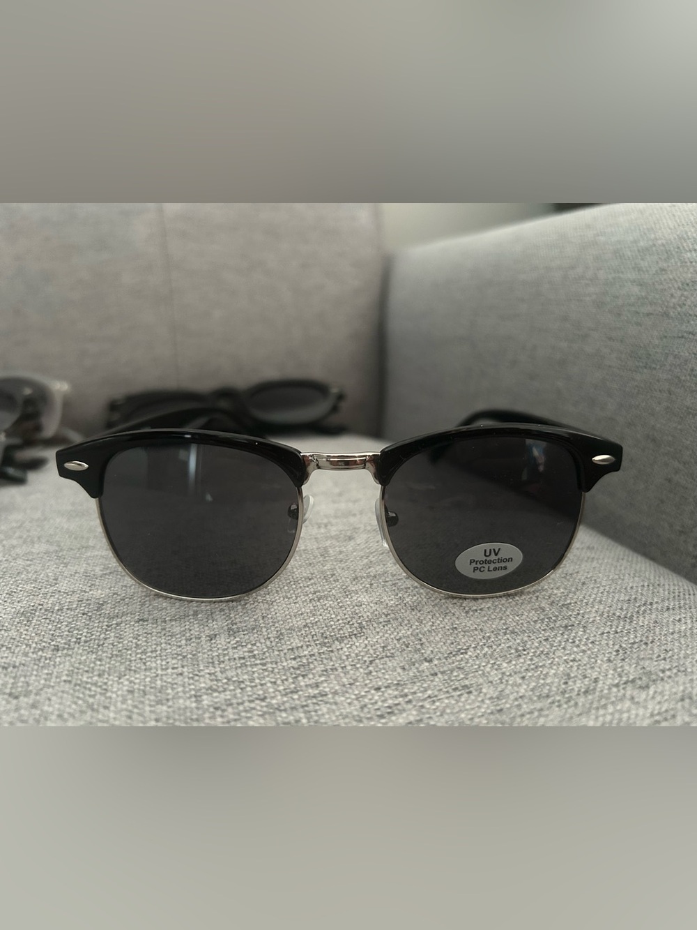 Black frame sunglasses with nose pads